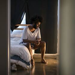 Public Housing Resident Joshua Tavares Sits in His Bedroom during the COVID-19 Pandemic, Collingwood, Victoria, 18 May 2020