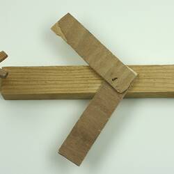 Wooden toy aeroplane, viewed from above.