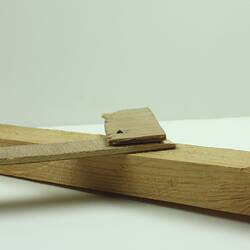 Wooden toy aeroplane, viewed from side.