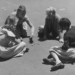 Playing Jacks in Government school playground, Melbourne, 1955.