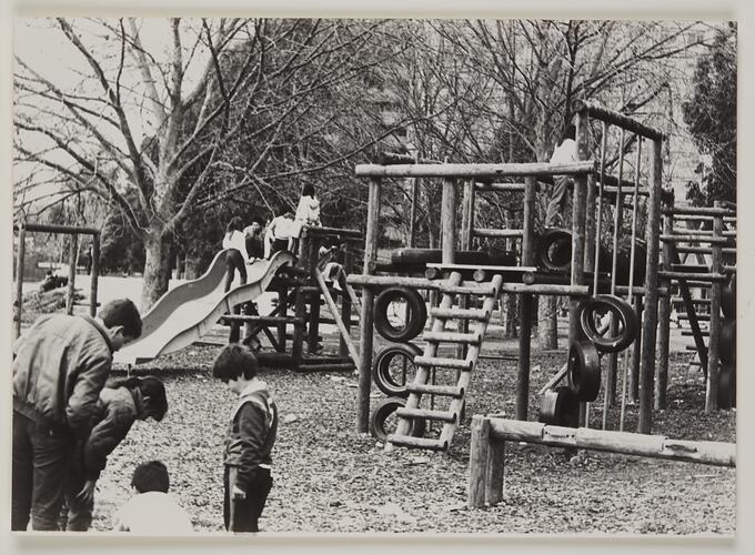 Children using play equipment in an adventure playground.