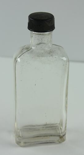 Clear rectangular bottle with black lid.