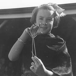Photograph - Girl Playing 'Parachute' String Game, Dorothy Howard Tour, Australia, 1954-1955