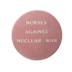 Pink round badge with white text.