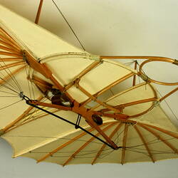 Model of off-white glider. Detail of cockpit. Underside view.