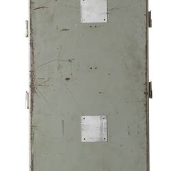 Side view of grey metal cabinet.
