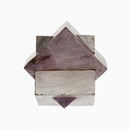 Wooden crystal model painted mauve and white.
