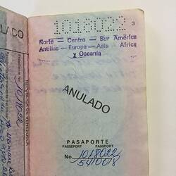 Open passport with coloured page, printed and handwritten text. Stamped.