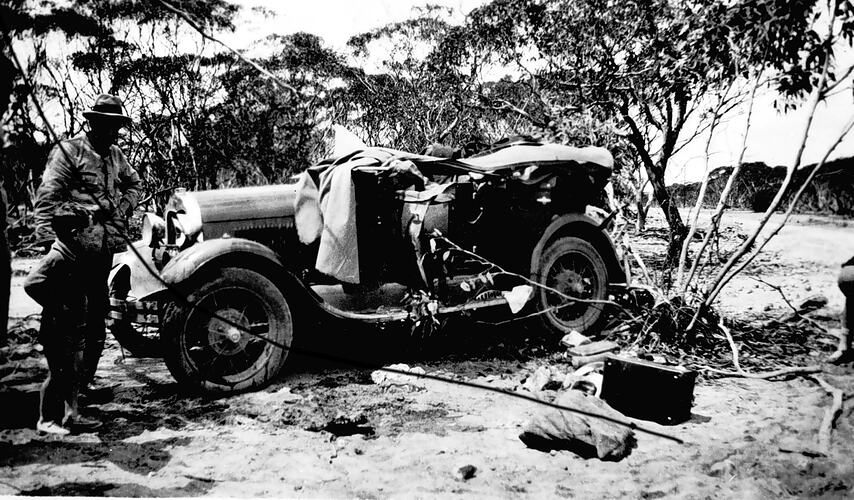 [A car that has rolled crushing its roof, South Australia, 1930.]