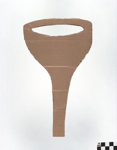 Thick, brown cardboard cut to resemble a funnel.