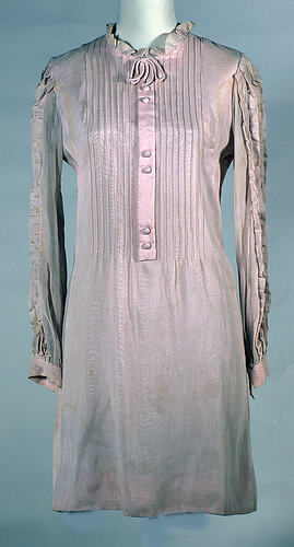 Victoriana style pale peach mini dress, ruffles, bow.