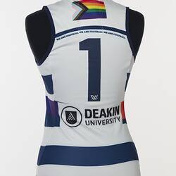 Women's AFLW guernsey with horizontal navy, white and rainbow stripes. Back view with navy number 1.