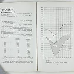 Open booklet with white pages and black printing. Graph on right page.