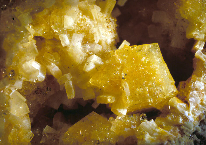 Detail of yellow crystalline mineral specimen.