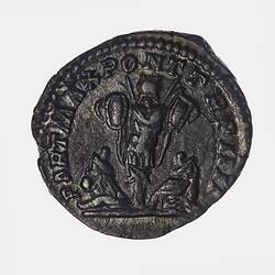 Roughly round coin. Trophy between two seated captive figures. Text around.