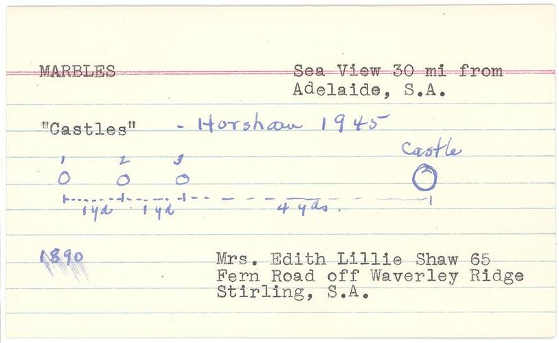 White index card with black typewritten text and blue handwritten text.