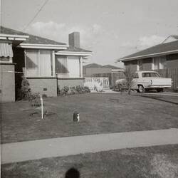 Digital Photograph - Man sitting on Front Steps of House with Baby, Gladstone Park, 1968