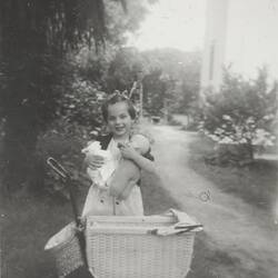 Digital Photograph - Girl with Dolls in Baby Brother's Pram, Backyard, Kew, 1953