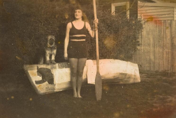 Digital Photograph - Girl Standing with Canoe & Dog, Backyard, Black Rock,  1930s