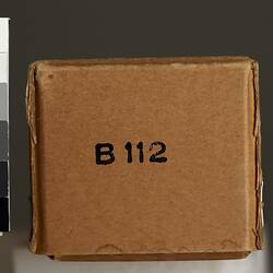 Brown cardboard box, black text, for paper tape.