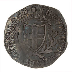 Coin, round, Within a wreath of palm and laurel a shield bearing the cross of St. George; text around.