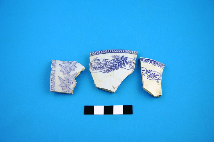Three earthenware cup rim fragments.