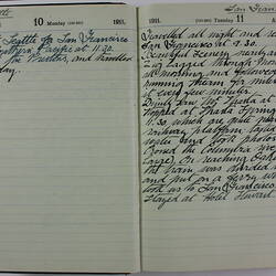 Open book showing handwritten diary entries.