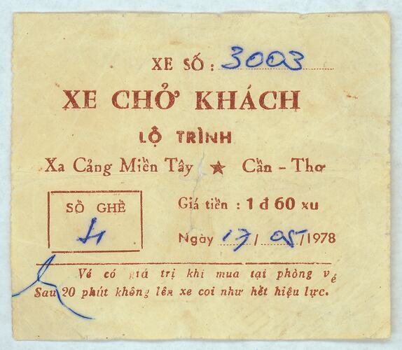 Cream paper ticket with brown printed text and hand written details in blue ink.