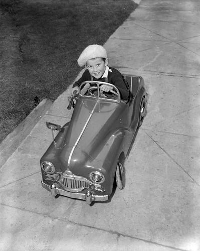 Child Driving a Toy Car, Melbourne, Victoria, 1953