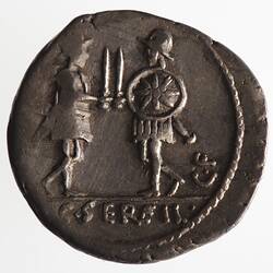 Round coin, aged, two figures facing each other, each holding shields and swords.