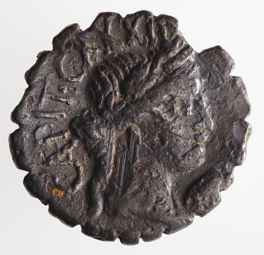 Round coin, aged, female profile, facing right, wearing headdress.