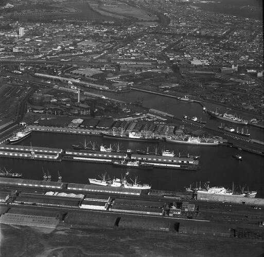 Monochrome aerial image of a shipping dock.