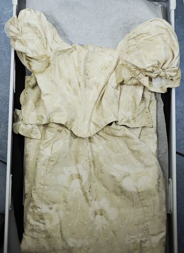 Cream dress showing upper bodice detail.