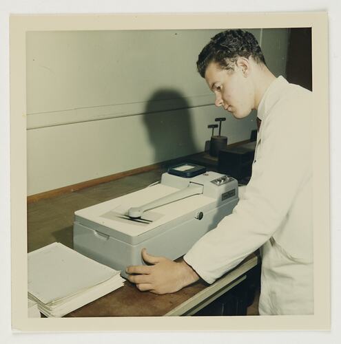 Slide 219, 'Extra Prints of Coburg Lecture', Worker Testing Photographic Paper, Kodak Factory, Coburg, circa 1960s
