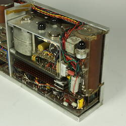 Open metal box. Case partially removed to show internal wires and components.