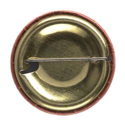 Back of round metal pin badge.