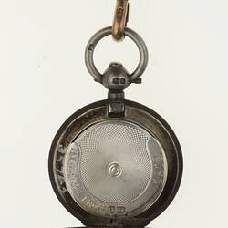 Detail of silver watch chain with silver sovereign case. Open.