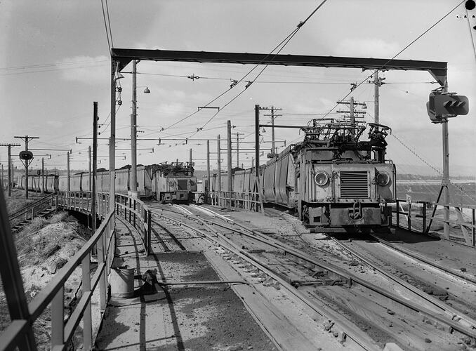 Two trains on side-by-side tracks.