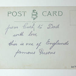 Printed back of postcard with handwriting.