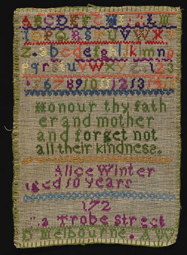 Embroidery sampler with coloured alphabet and verse.