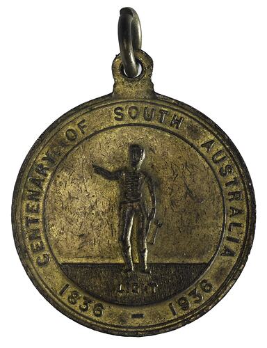 Round medal, lettering around. At centre figure of man standing, raising right arm. Suspension loop at top.