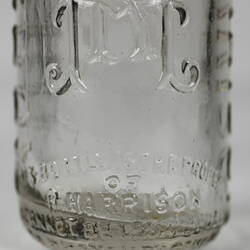 Base of clear glass bottle.