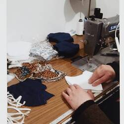 Photograph - Making Face Masks, Folding Lining, EMAAN Store, Sydney Road, Coburg 2020