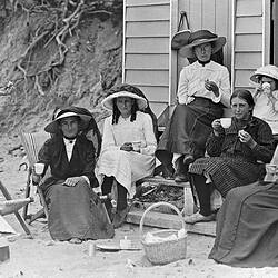 [Lilian Louisa Pitts (left) photographs herself having a picnic with friends, Point Lonsdale, 1914.]