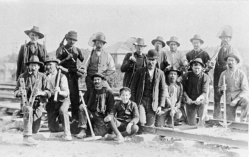 [Railways construction staff posed with their tools, Budgeree, circa 1908.]