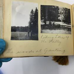Two black and white photos glued on page of album with handwritten annotation in pencil underneath.