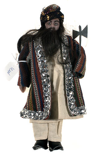 Iranian warlord doll in traditional dress.