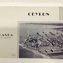 White page with dark blue text. Sea innlet/harbour at lower right.