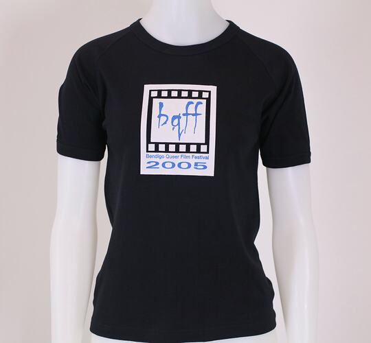 Black t-shirt with printed logo on mannequin.
