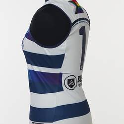 Women's AFLW guernsey with horizontal navy, white and rainbow stripes. Three quarter back left view.